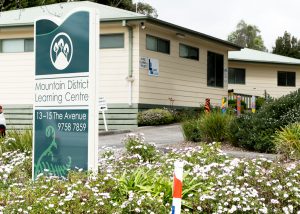 Image shows exterior of Mountain District Learning Centre with entry point from the road