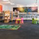 Interior image of childrens section of Doveton Library showing colourful furniture and shelving with books