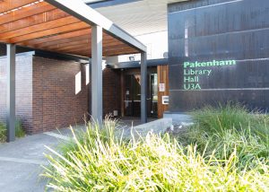 Main entrance to Pakenham library and community hall with covered walkway and glass entry doors and