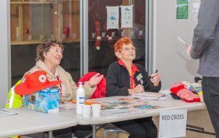 Red Cross volunteers providing assistance at an emergency evacuation centre