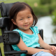Young asian girl in wheelchair pictured outside