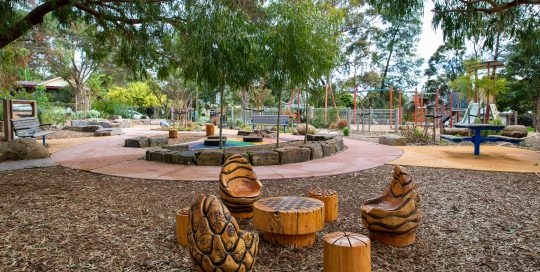 Wellesley Play Space with childrens carved wooden furniture and play equipment
