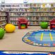 Wallan Library children's section with bookshelves and books, colourful rug on floor anc olourful furniture