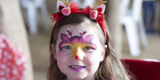 Young girl with face painted