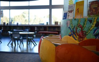 Childrens section at Cambridge Library showing colourful book boxes and furniture