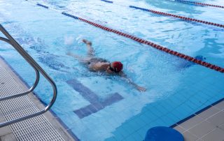 A person swimming in a pool at Bold Park Aquatic