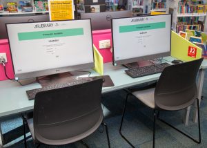 Two desktop computers on a desk at Hastings Library