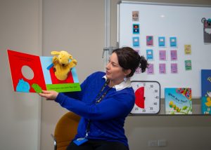 Librarian reading a story during storytime at the library