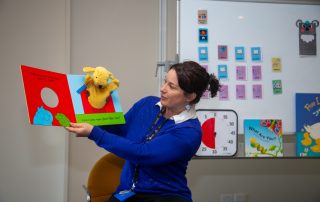 Librarian reading a story during storytime at the library