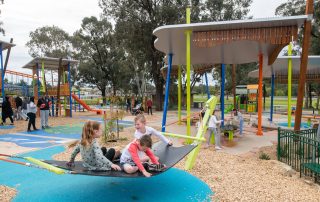 Strathdale Park Playspace with play equipment and children