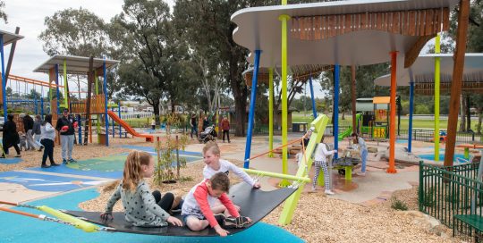 Strathdale Park Playspace with play equipment and children